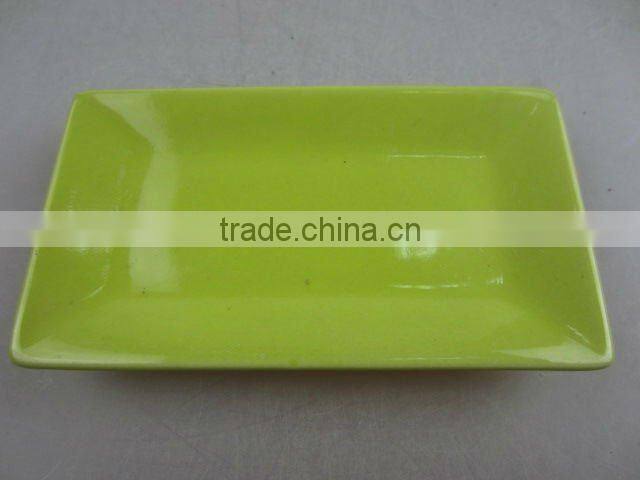 Stock glazed porcelain rectangle sauce dish