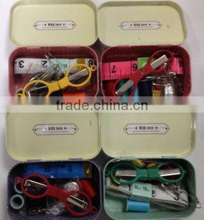retro sewing kit in tin