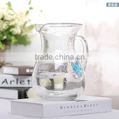 hand blown glass pitcher with sea star