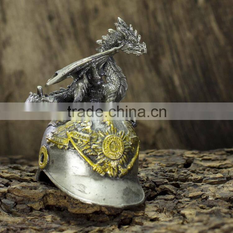 Pewter dragon with helmet figurine