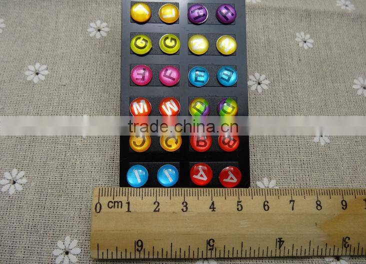 Oil drops adhesive letters stud earrings