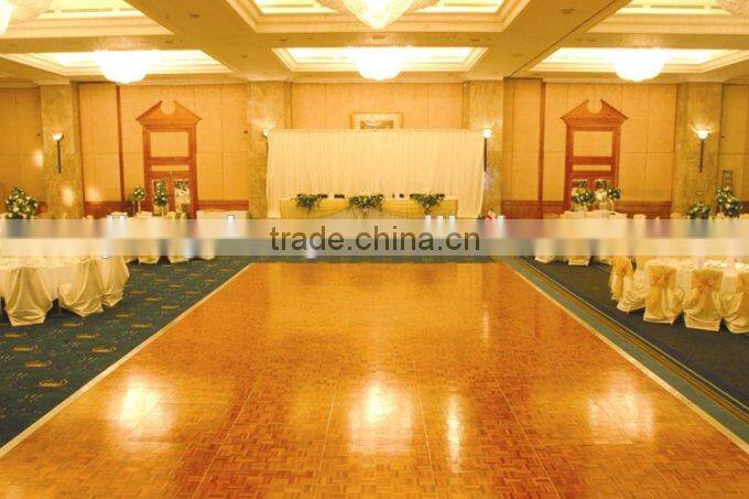 Natural teak wooden dance floor with gold anodized aluminum trim