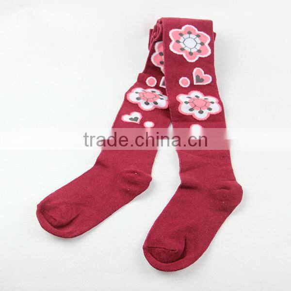Red colored girls tight leggings with fashion flowers