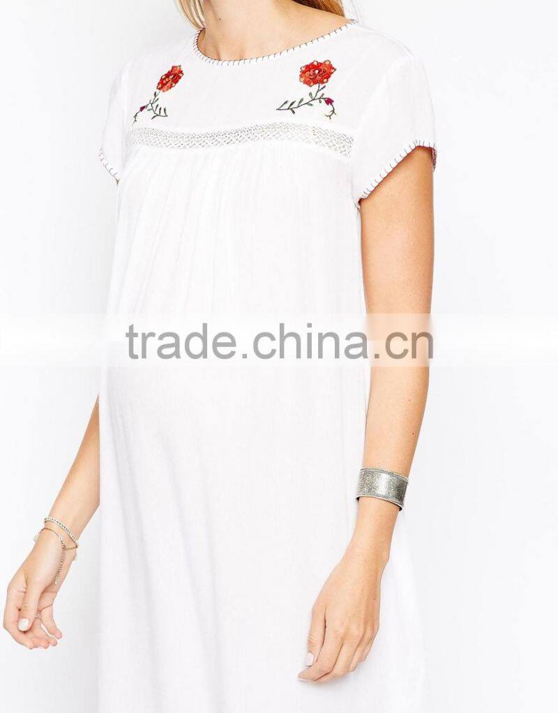 Maternity Embroidered Swing Dress With Dipped Hem China supplier