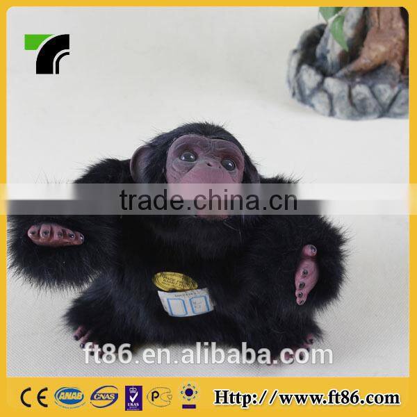 Furry toy looking up lifelike fake animal gorilla