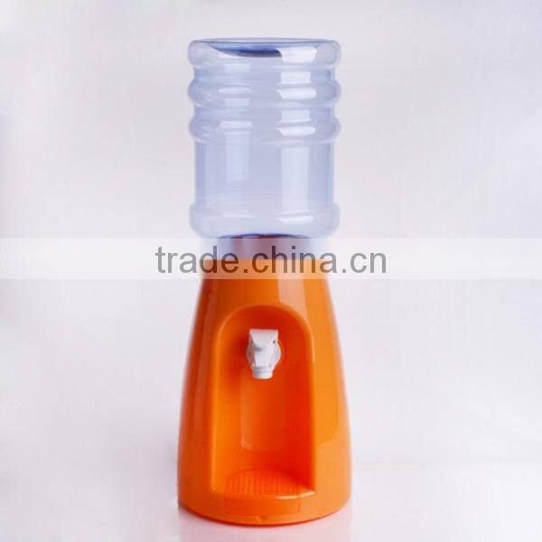 colorful plastic juice dispenser with blue stand and fire hydrant