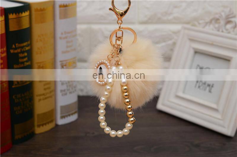 2021 Wholesale custom luxury fur ball key holder Pearl keychains pom pom bow keychain for women bag good quality