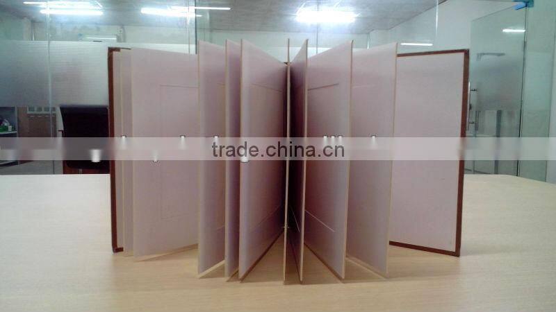 Photo album with brown hard cover and duplex board