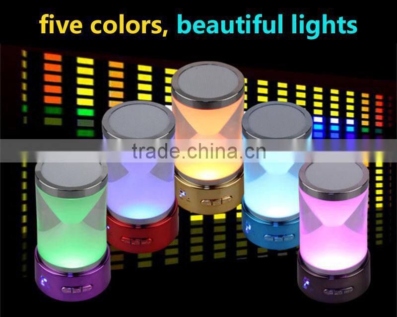 2016 new design hourglass portable wireless music mini bluetooth speaker with magic led light and fm radio/remote