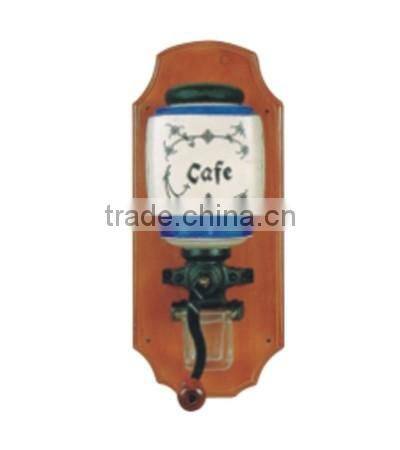 archaistic manual coffee grinder with wooden case