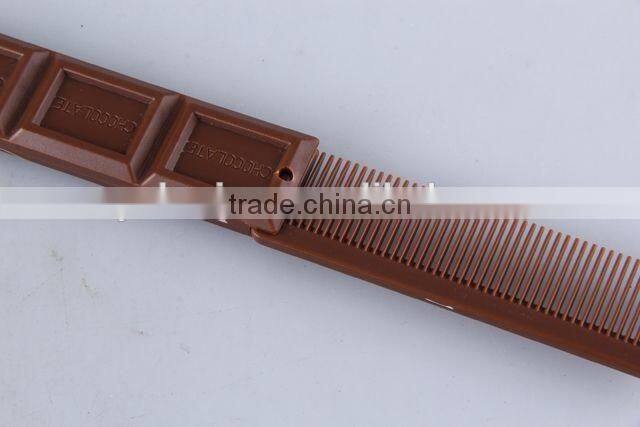 Chocolate shaped hair brush with hanging chain/folding comb
