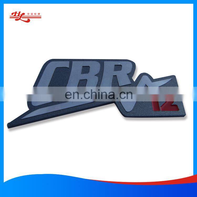 Metal casting nameplate with adhesive