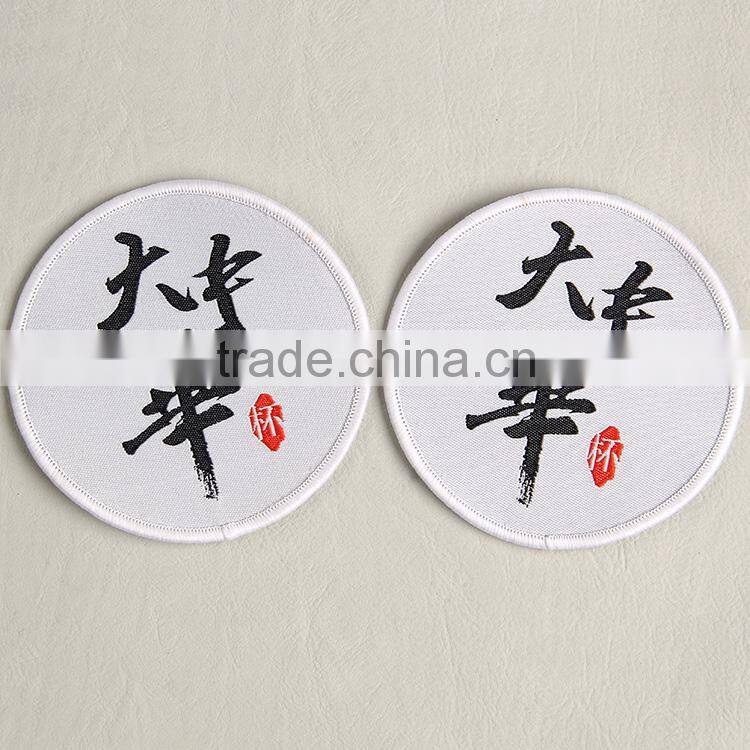 Hangzhou label company manufacture white woven badge label for cluture clothing