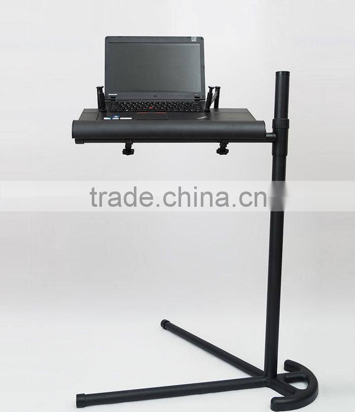 Portable folding notebook desk stand with mouse pad in bed