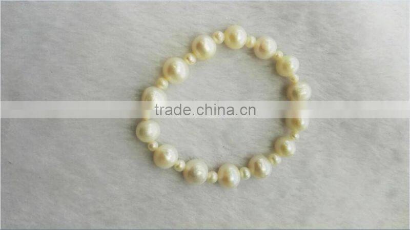 AA 8mm white with 2mm white round freshwater pearl bracelet