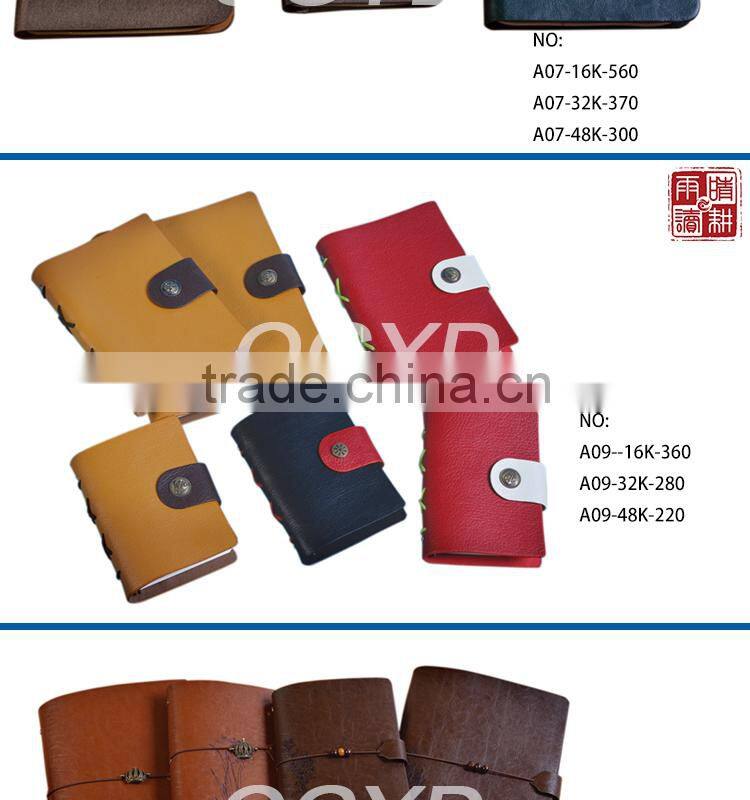 brown color notebook with metal nameplate elastic bind
