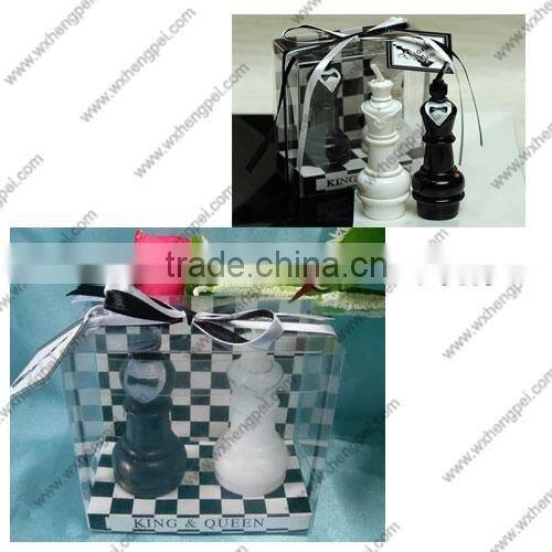 Wedding candles on the chess king and queen
