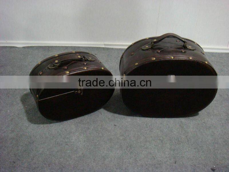 Egg-shaped antique leather suitcase