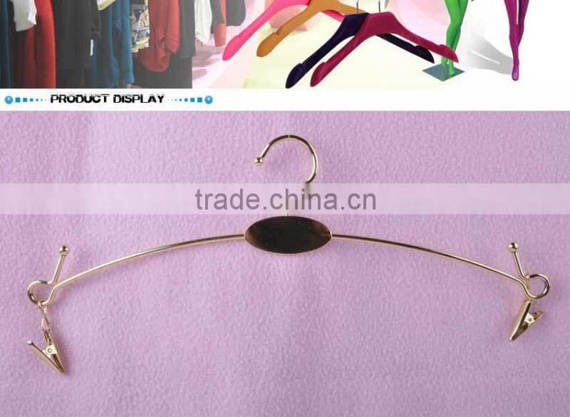 Gold metal hanger with clips for bikini clothes