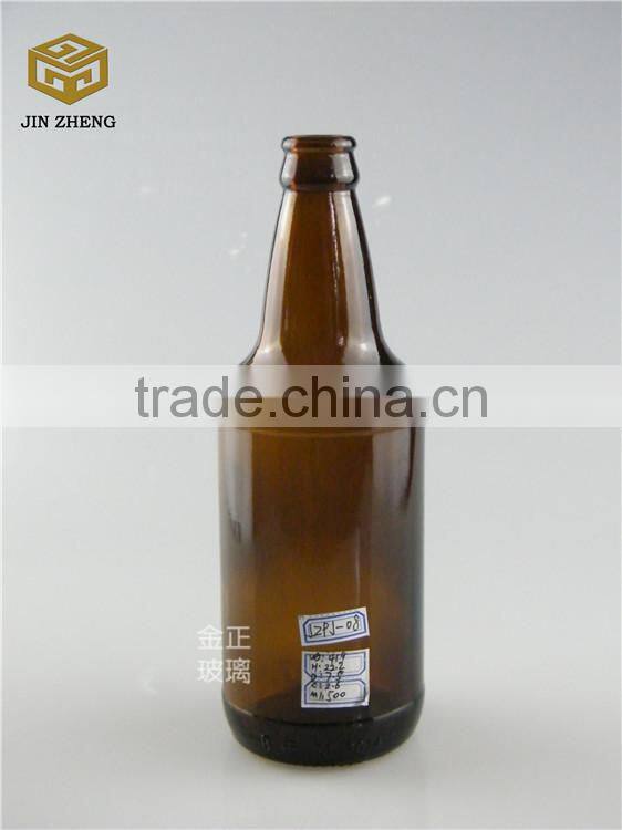 330ml dark amber open beer bottle with fridge magnet