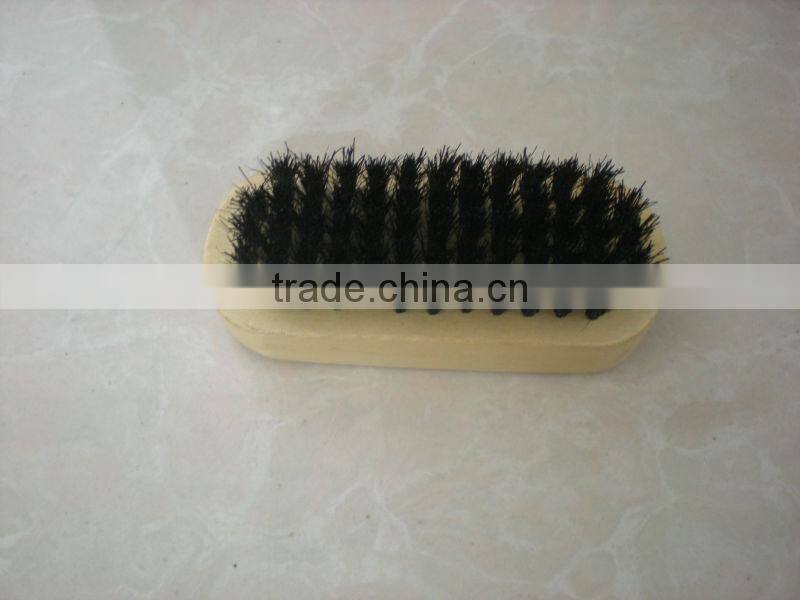 small wooden shoe brush
