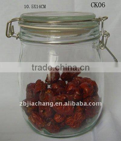 Clear glass food storage bottle with metal clip