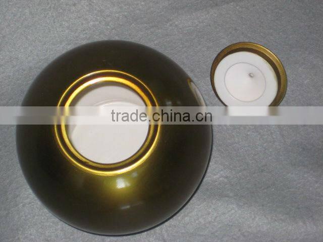 Golden ceramic urns for ashes
