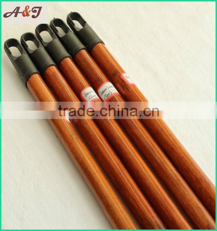 varnished wooden broom handle with long hanger