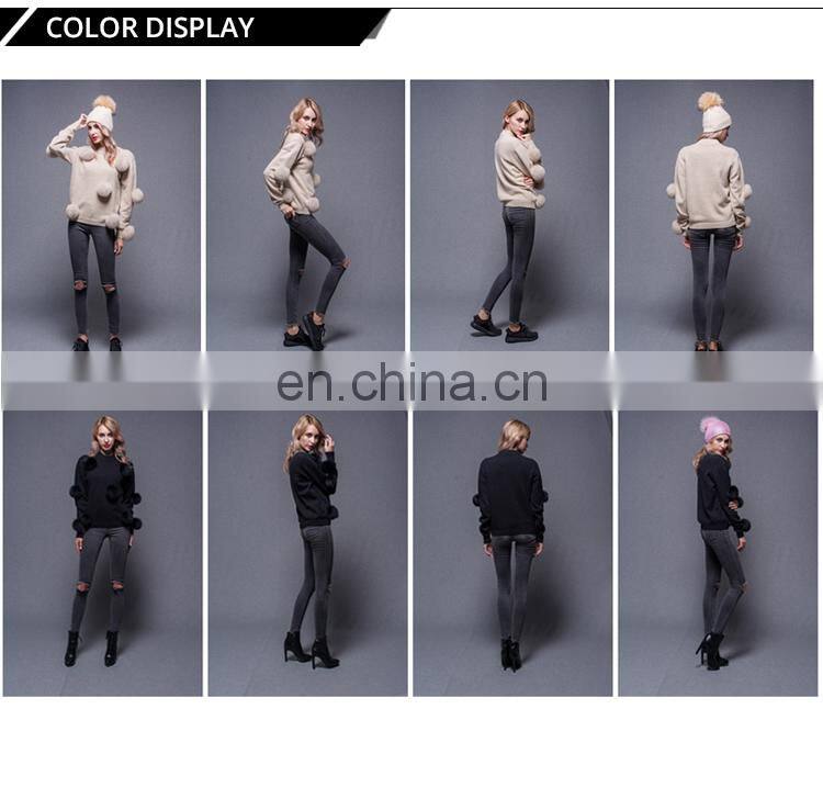 Woman black custom pullover sweater with a lot fox fur ball