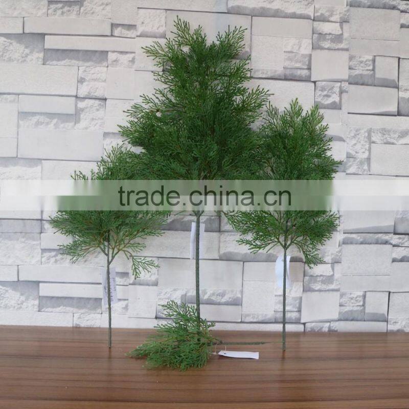 Plastic green cypress branch