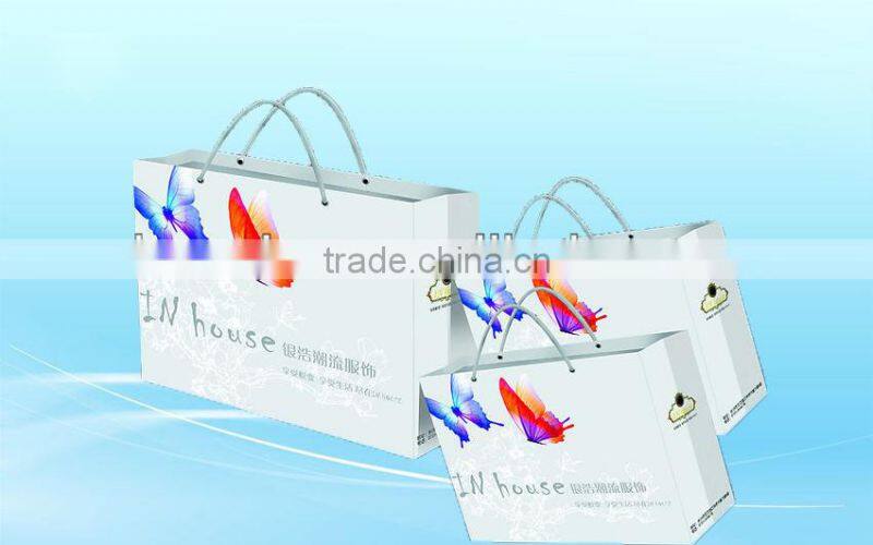 Red shopping paper bags with satin handle