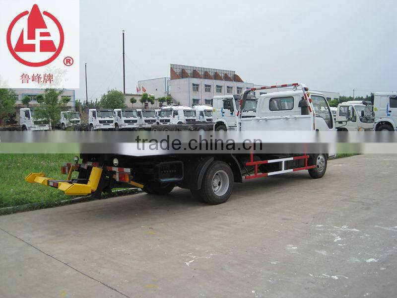 Light Duty ISUZU 5 Ton slide flatbed road wrecker tow truck for sale which could transport 20ft container,equipment and machines