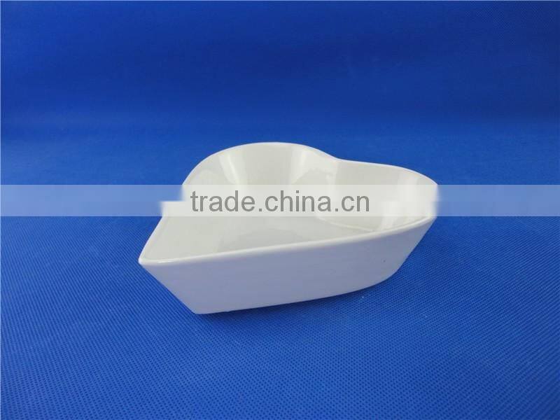 white ceramic heart shaped bowl