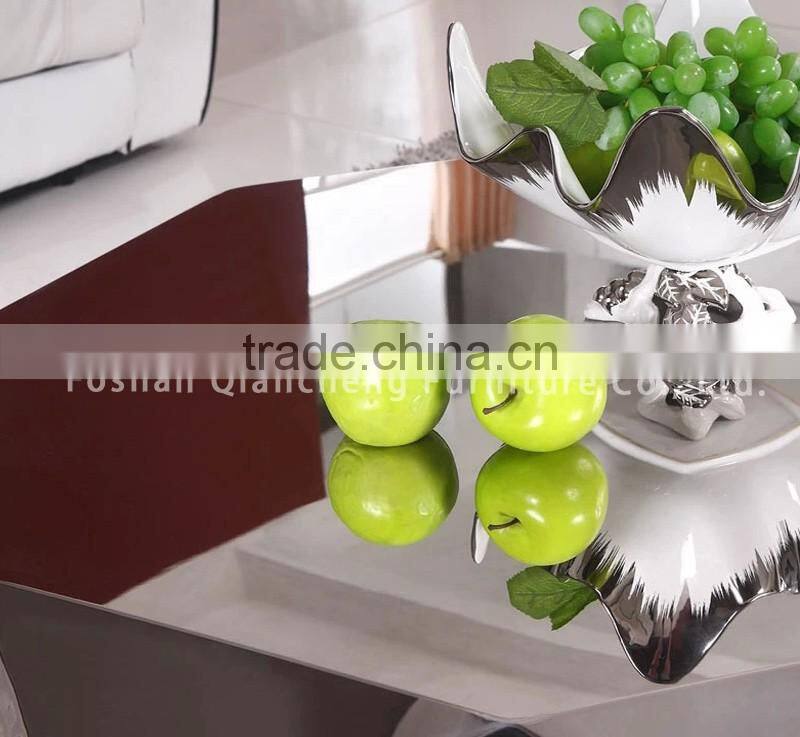 Diamond shape coffee table with stainless frame