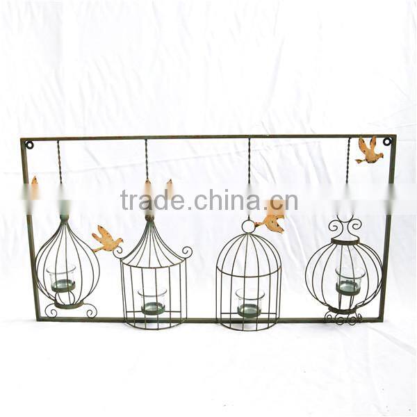 Metal tree branch with birdcage style wall plaque