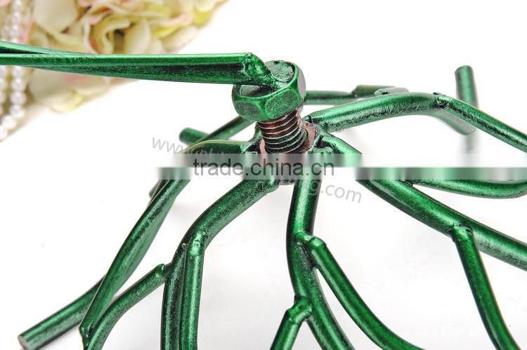 Metal display stand for jewelry with a birdcage for earrings