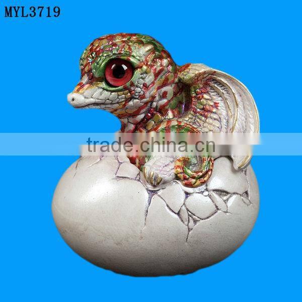 Resin hatching from egg baby dragon statuette