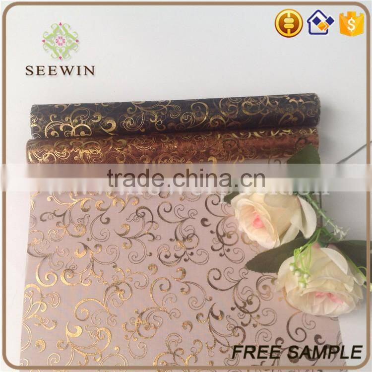 gilding rolls of organza fabric