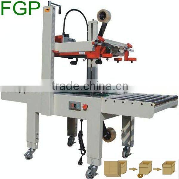 FXJ-5050 top & bottom drive paper carton automatic adhesive tape sealing machine