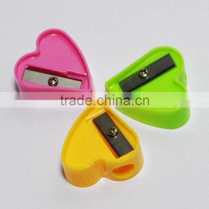 One hole plastic novelty heart shaped pencil sharpener