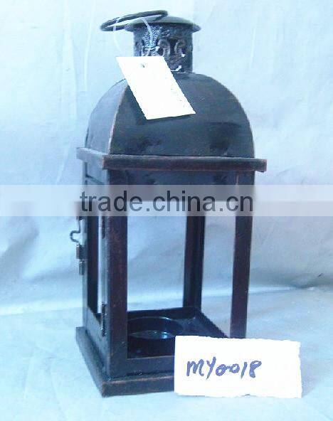 Antique brown metal lantern with clear glass wall