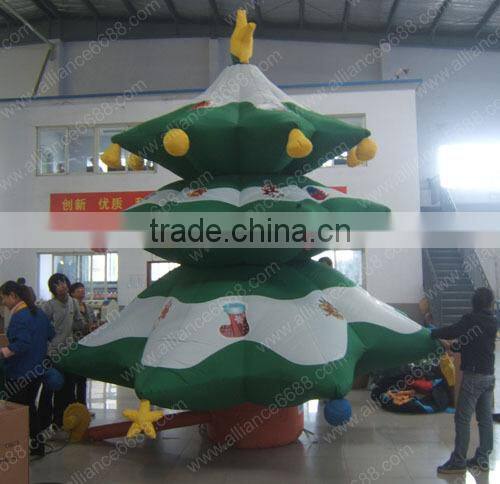 green snowing inflatable christmas tree