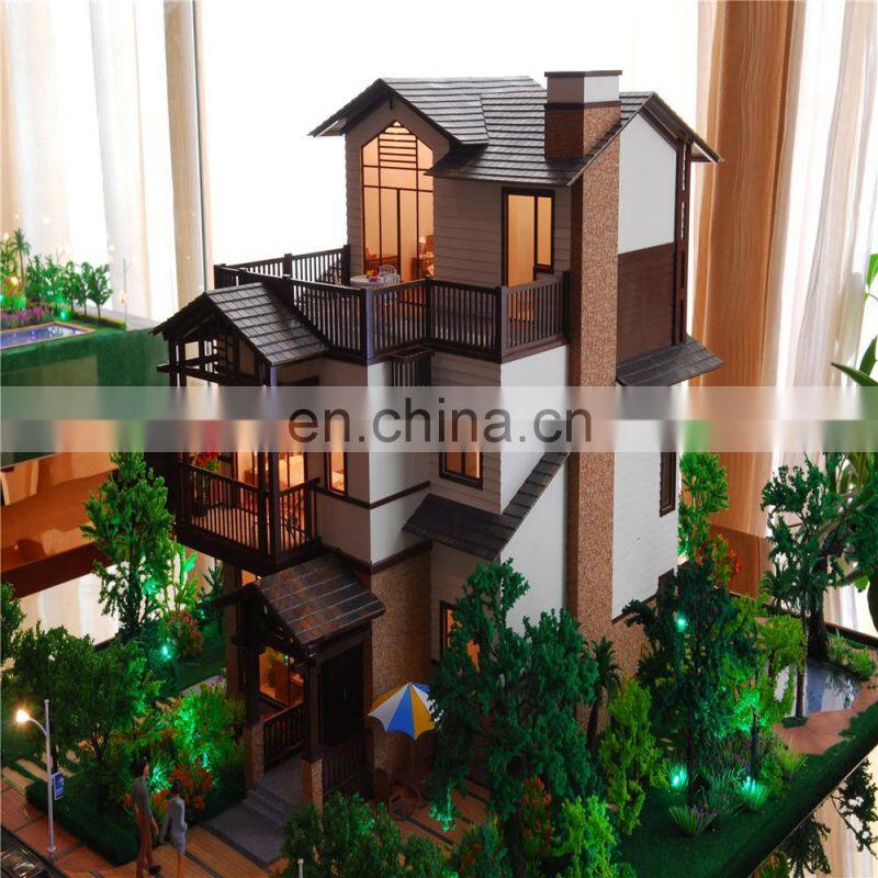 Small house model with warm light effect, architectural maquette