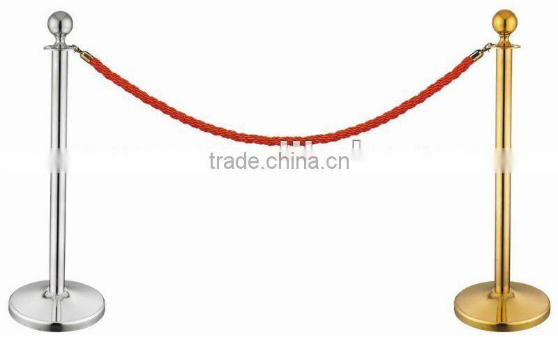 Painting black base of stanchion post for event with rope