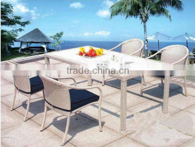 space-saving rattan hideaway dining table and chair set