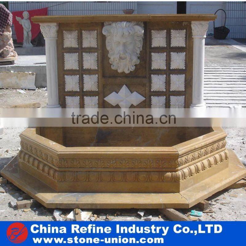 wall fountain carved with human figures