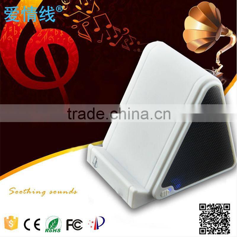 2015 China fashion portable magic induction speaker with phone holder