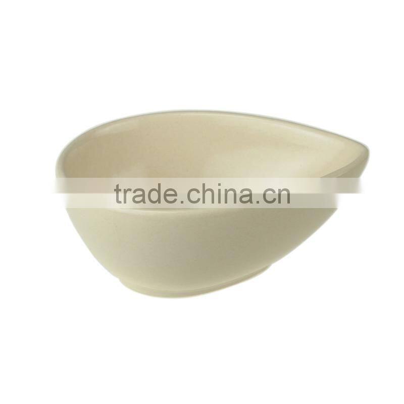 beige glazed ceramic salad bowl in water drop shape