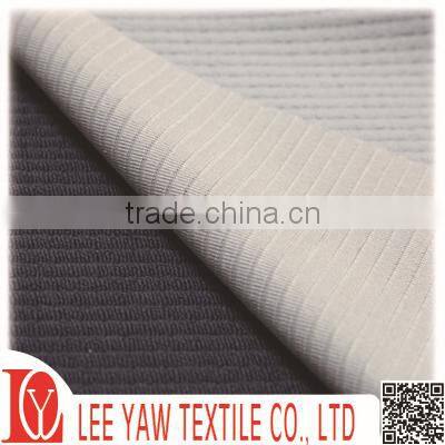 check terry fabric made of 94% polyester and 6% spandex with wicking treatment