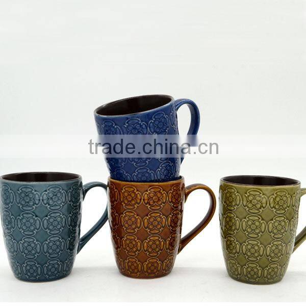 Round shape with flower embossed ceramic mug from China